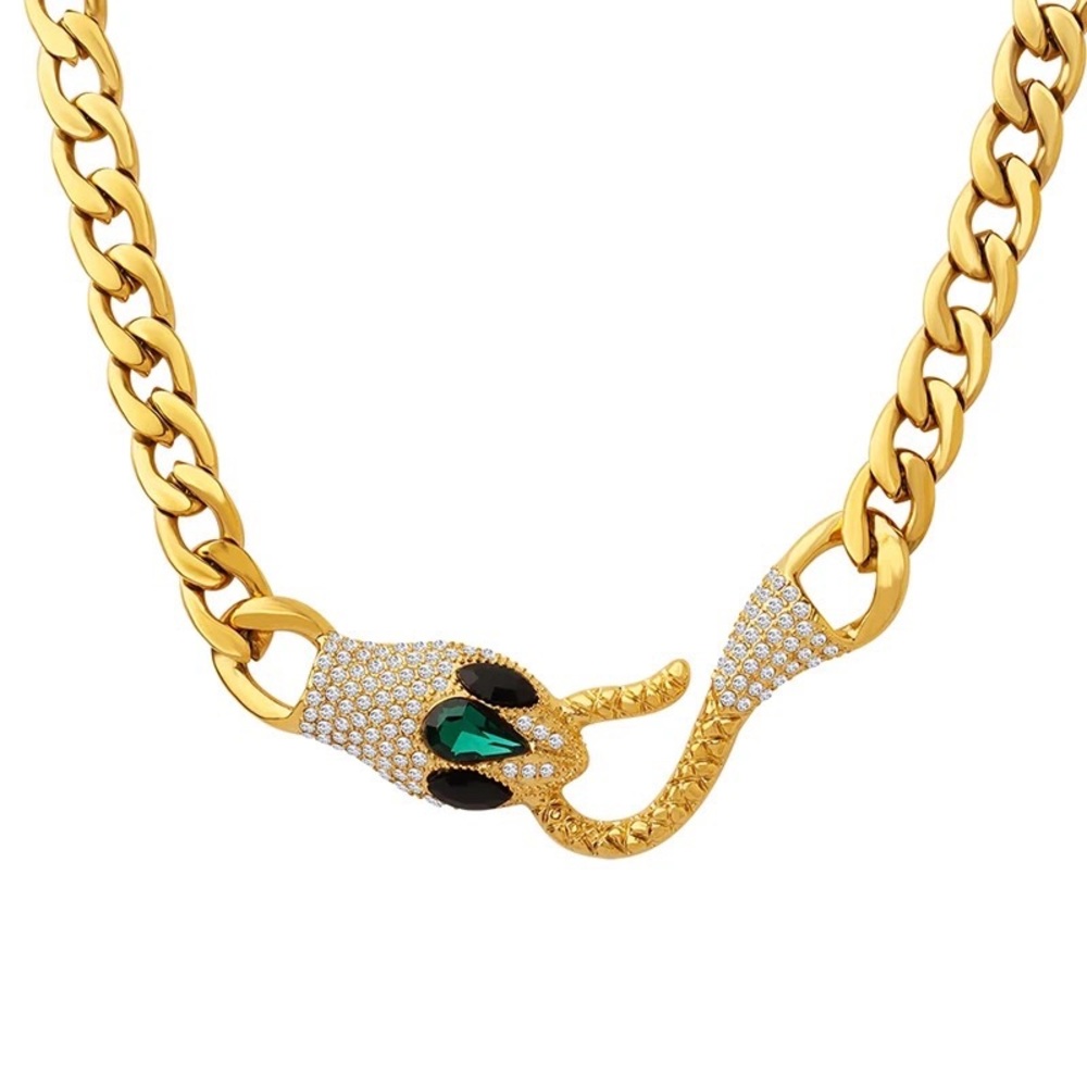 Chunky gold-tone stainless steel necklace with emerald looking eyes.